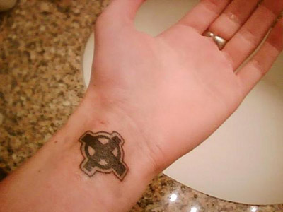 cross tattoo on wrist. heart wrist tattoo. heart
